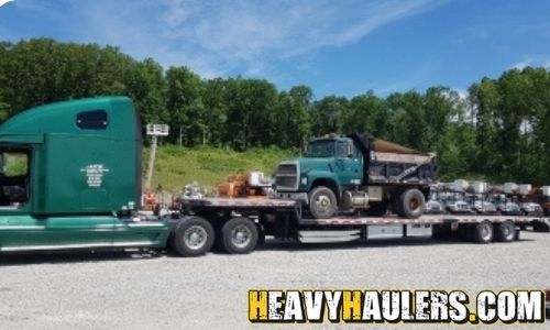 Dump truck haul on a step deck trailer.