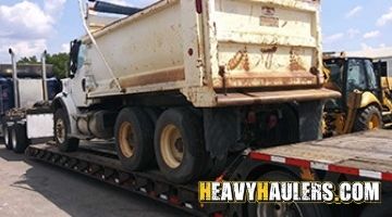 Shipping a Freightliner tadem dump truck on a trailer from Delaware.