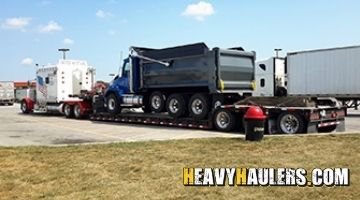 Transporting a Kenworth dump truck on a trailer from Louisiana.