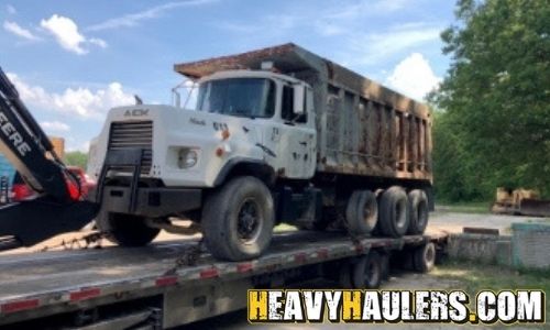 Shipping a Mack dump truck on a trailer.