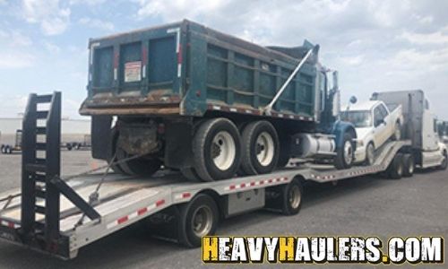 Dump truck transport on a hot shot trailer.