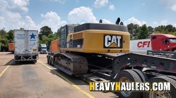 Transporting a Caterpillar excavator on an RGN trailer.