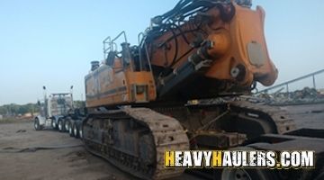 Loading a Liebherr demolition excavator on a trailer.