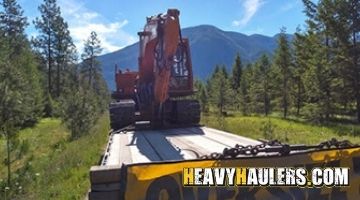 Hauling a Hitachi excavator on a hotshot trailer.