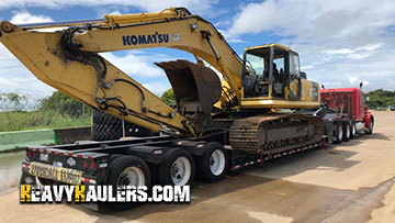 RGN trailer for excavator transport.