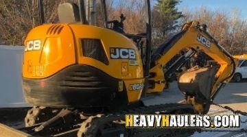 Hauling a JCB mini excavator.