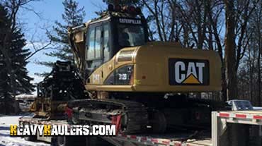 Shipping a Caterpillar excavator with attachments.