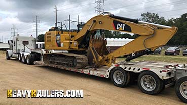 Transporting a Caterpillar excavator from Maine.