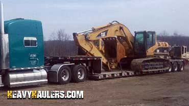 Shipping a Caterpillar excavator on a trailer.