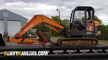 Moving a Doosan mini excavator.