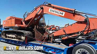 Oversize excavator haul on a trailer.