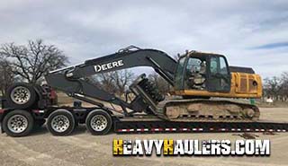 Transporting a John-Deere-210G LC Excavator on a 9 axle RGN.
