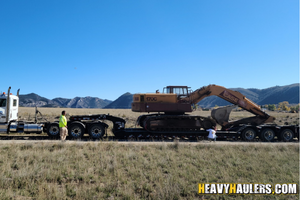 Case 170C excavator haul.