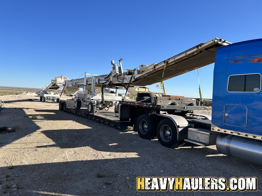 Transporting an oversize conveyor trailer load.