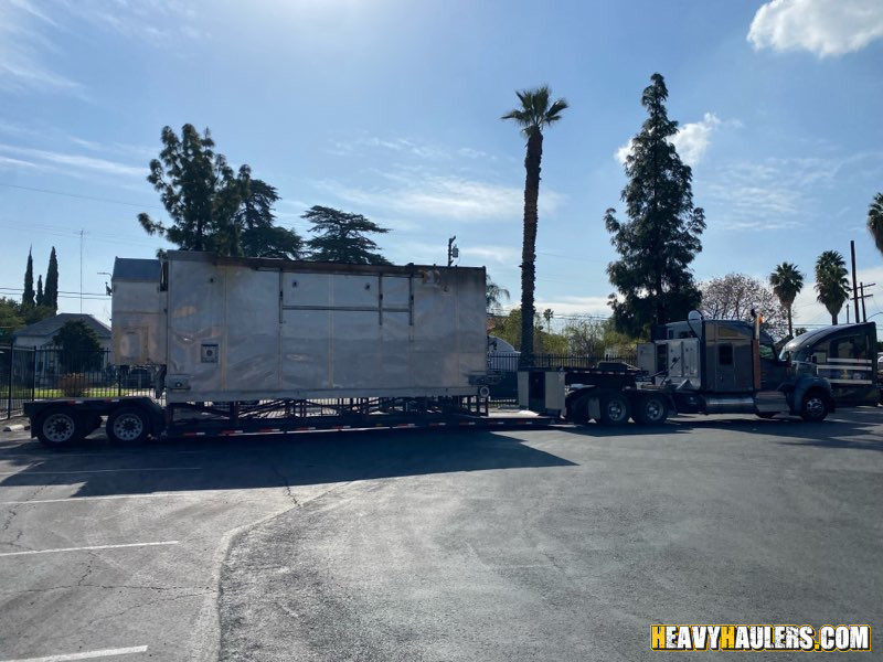 Shipping an oversize spray dryer on a lowboy trailer