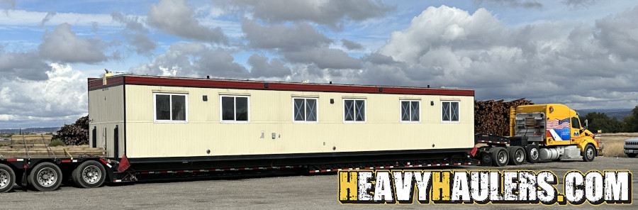 Wilson conveyor trailer shipped on an RGN.