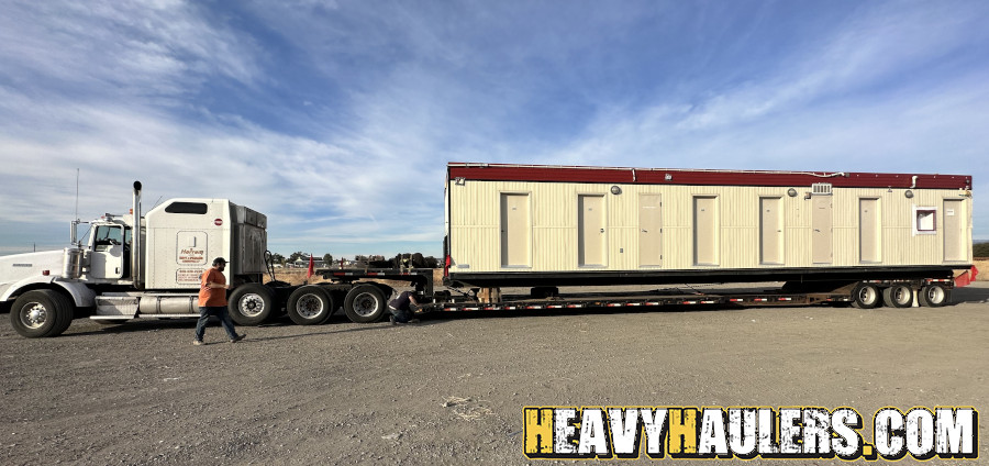 Wilson conveyor trailer shipped on an RGN.