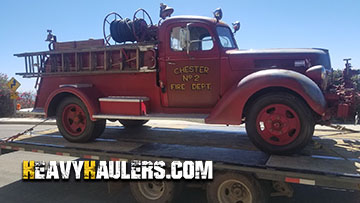 Hauling an antique Ford fire truck.