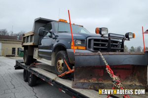 Shipping a Ford F-350 Plow Truck on a trailer.