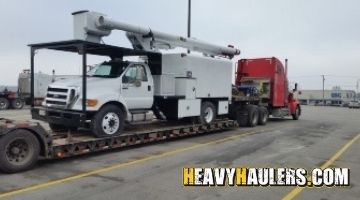 Transporting a Ford bucket truck.