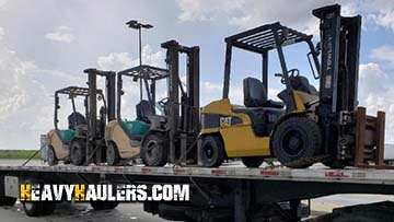 Transporting Caterpillar forklifts on a trailer from Iowa.