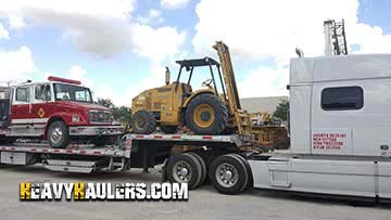 Shipping a forklift on a step deck trailer.