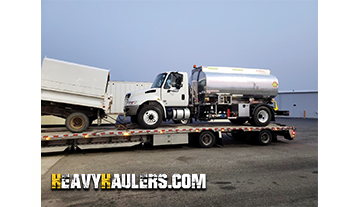 Hauling an International fuel truck.