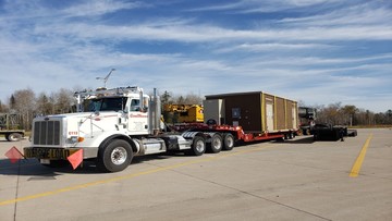 Loading a landoll trailer.