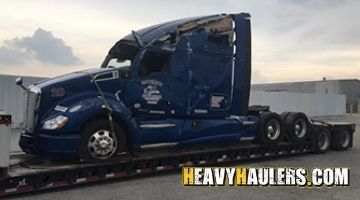 Transporting an inoperable Kenworth sleeper on an RGN trailer.