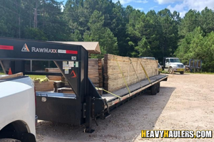 Hauling wood trusses on a hot shot trailer.