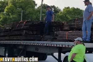 Stacks of lumber transported on a flatbed trailer.