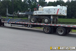 Loading 3D imaging machine and office supplies on an enclosed trailer.