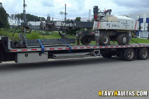 Loading 3D imaging machine and office supplies on an enclosed trailer.