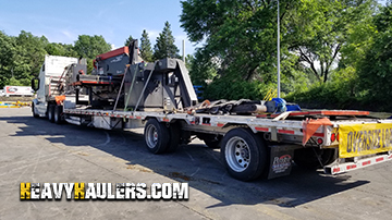 A turret press being towed