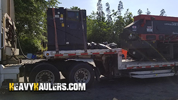 A turret press being hauled by Heavy Haulers