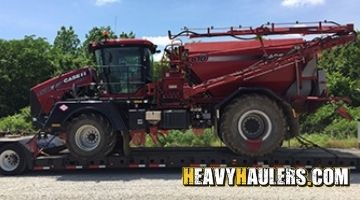 Hauling a CASE IH FLX4530 on an RGN trailer.