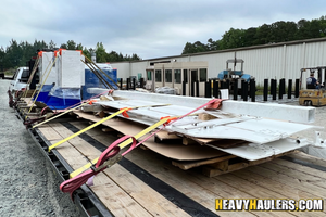 Hauling buttresses and pallets, wedge barriers, and crash beams.