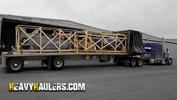 Airplane fuselage being hauled