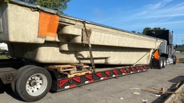 Transporting a fiberglass pool.