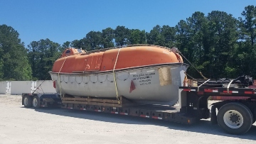 Shipping a life boat on a trailer.