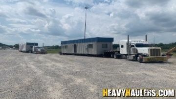 Shipping an office trailer on an RGN trailer.