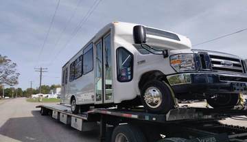 Transportation of a Ford shuttle bus.