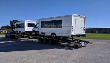 Hauling an OV shuttle bus on a trailer.