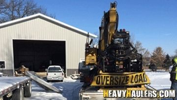 Oversize hydraulic excavator transport.