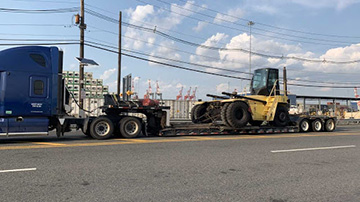 Hyster equipment hauled on an RGN trailer