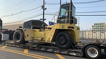 Hyster equipment hauled on an RGN trailer