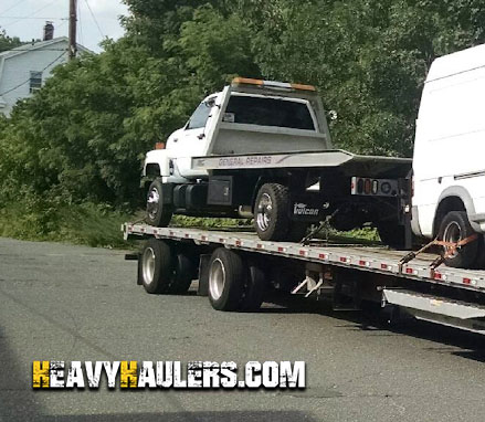 Rollback Truck Being Loaded