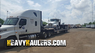 Transporting a rollback truck on a stepdeck