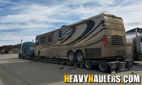 Class A RV transport on a drop deck trailer.