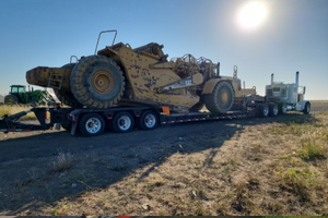 2003 Caterpillar 623 scraper transport.